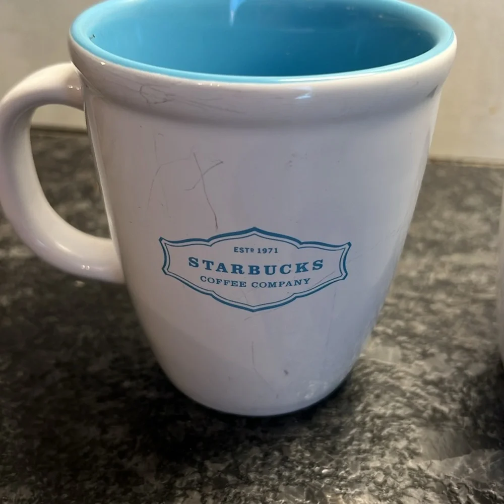 2-13oz Starbucks 2006 white and blue coffee mugs. In excellent condition.